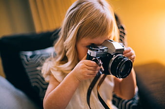 Young Girl Holding Vintage Minolta Camera