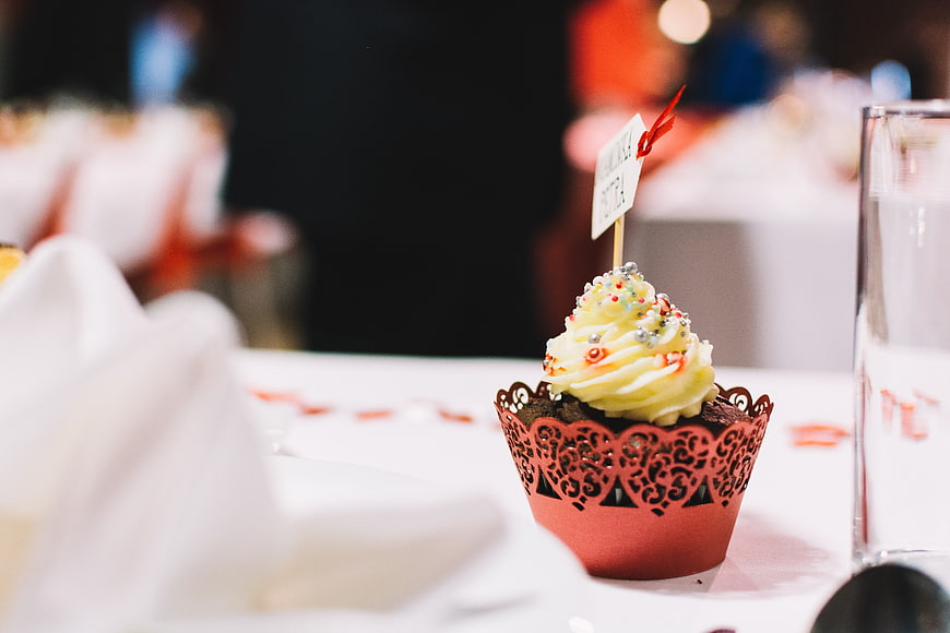 Chocolate Cupcake with Red Heart Wrapper on Wedding Table