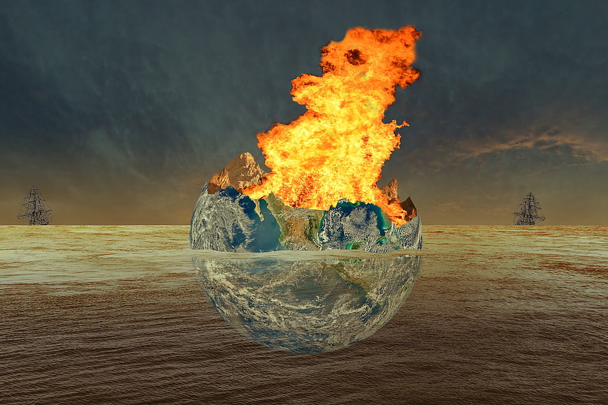 Burning Earth Globe Floating in Ocean with Sailing Ships