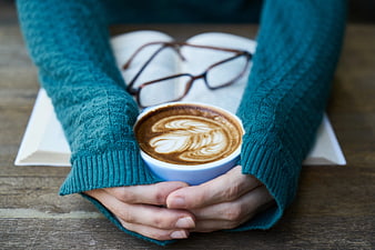 Cozy Hands Holding Latte with Book and Glasses