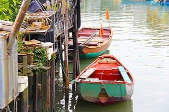 Traditional Colorful Wooden Boats Docked at Waterfront Village