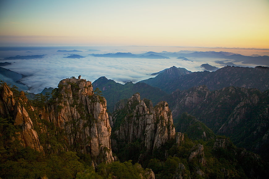Sunrise over Huangshan Mountain Peaks with Sea of Clouds