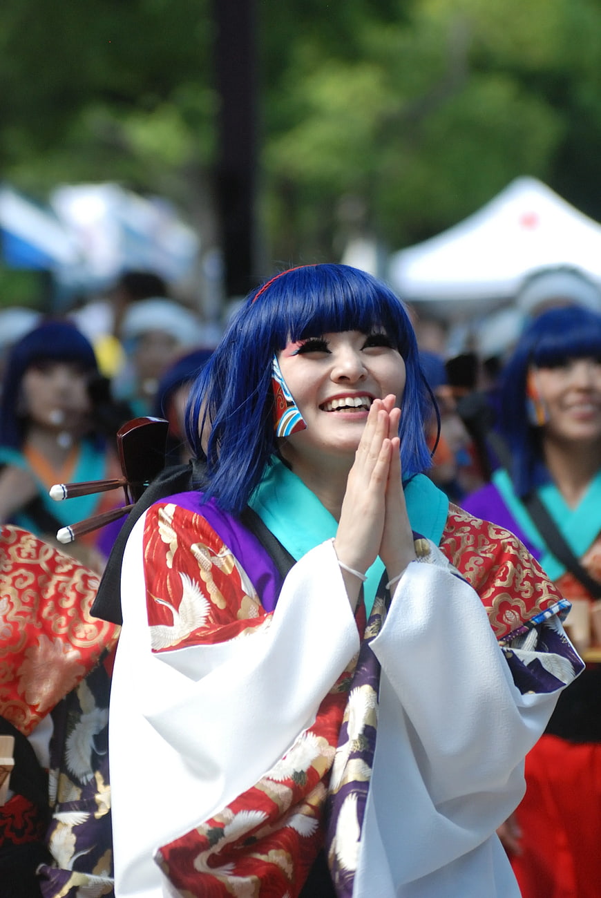 Joyful Woman in Traditional Japanese Costume with Blue Wig