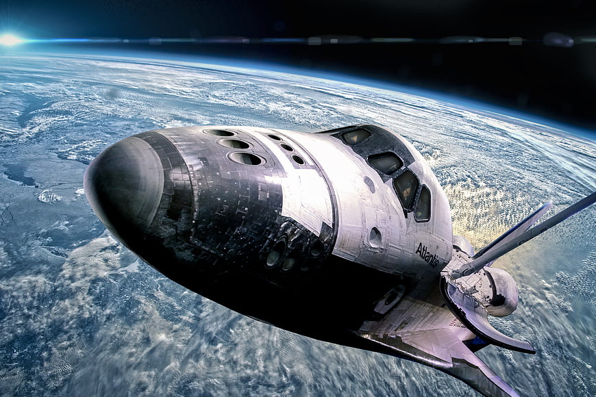 Space Shuttle Atlantis Orbiting Earth in Space