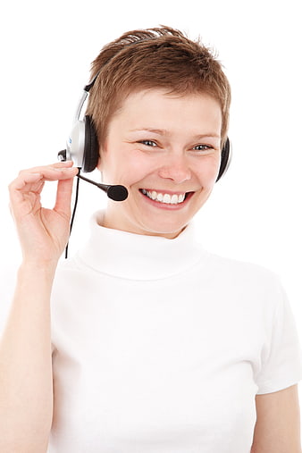 Smiling female call center agent wearing headset