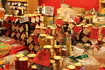 Colorful Christmas Market Stall With Jars Of Honey And Preserves