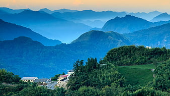 Scenic Mountain Landscape with Tea Plantations and Village