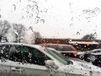 Frozen Ice Crystals on Car Window with Blurred Background