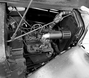 Vintage car engine bay in black and white