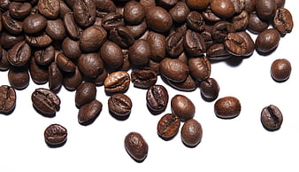 Roasted Coffee Beans Scattered On White Background