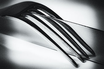 Close-up black and white photo of fork and knife