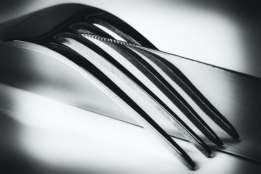 Close-up black and white photo of fork and knife