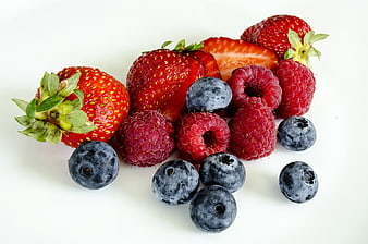 Fresh mixed berries on white background