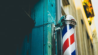 Classic Barber Pole on Teal Wall