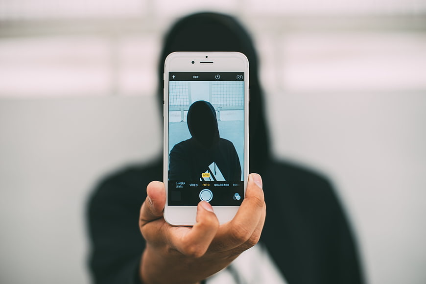Anonymous Person Taking Selfie With White Smartphone
