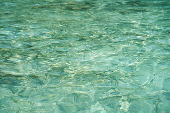 Crystal Clear Turquoise Water Surface with Ripples