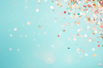 Colorful Confetti Falling on Pastel Blue Background