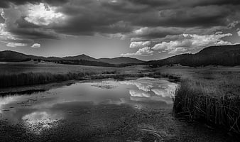 Dramatic Black and White Mountain Landscape with Cloud Reflection