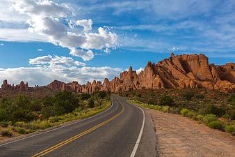 Scenic Desert Highway Winding Through Red Rock Formations