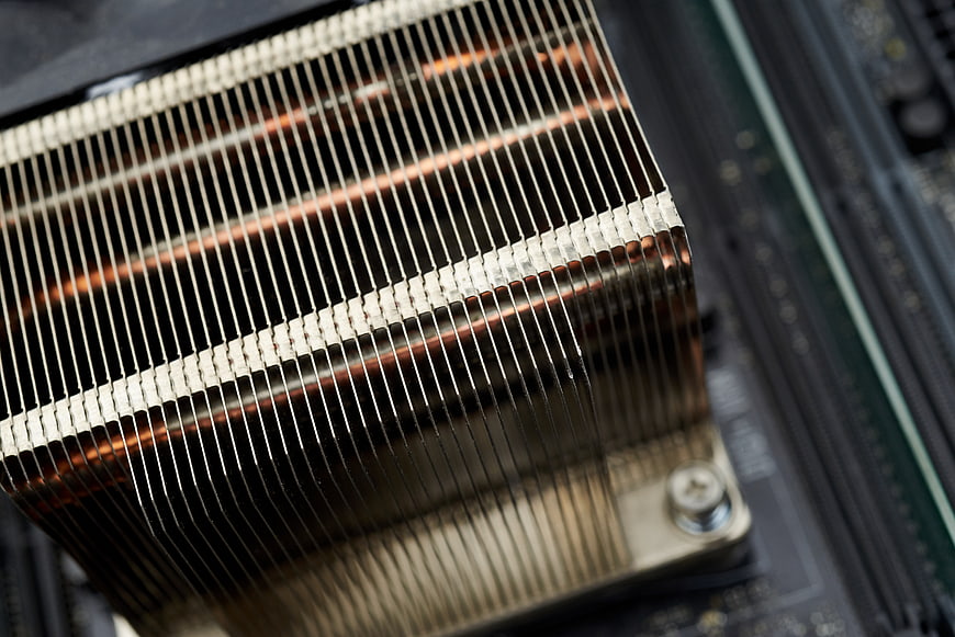 Close-up of copper CPU heat sink on motherboard