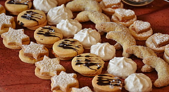 Assorted Christmas Cookies and Pastries on Red Table