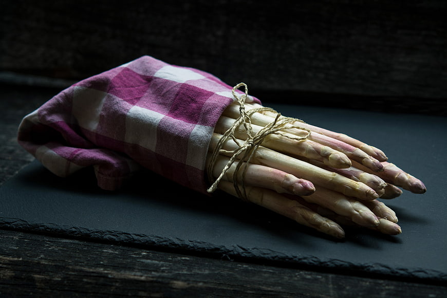 Fresh White Asparagus Wrapped in Checkered Cloth