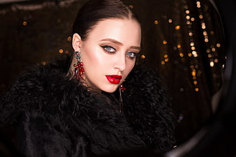 Elegant Woman Portrait Wearing Black Fur Coat and Red Earrings