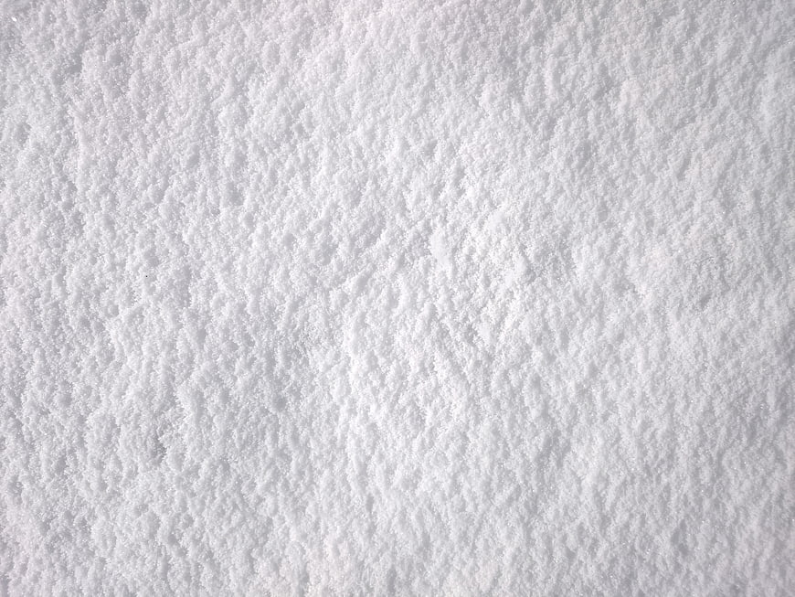 Close-up texture of fresh white snow surface
