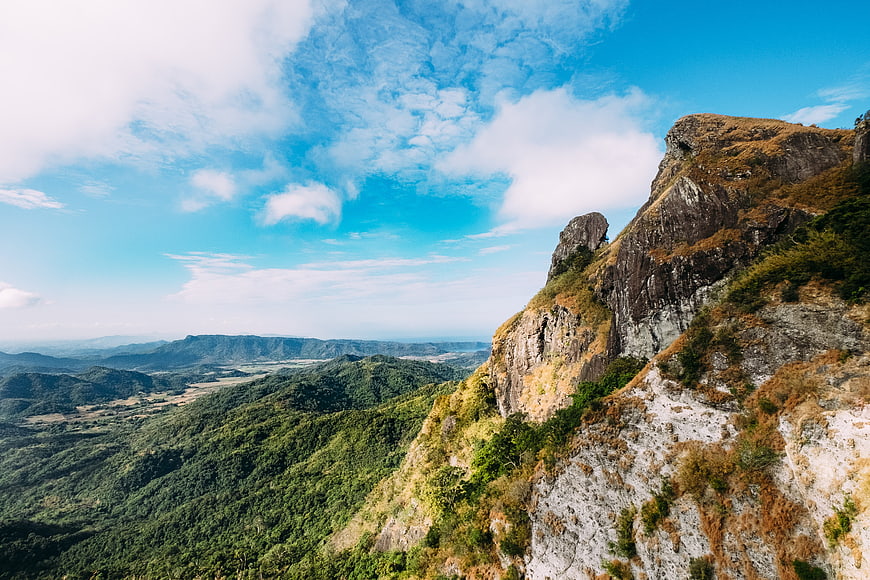 Dramatic Rocky Mountain Peak Overlooking Lush Green Valley