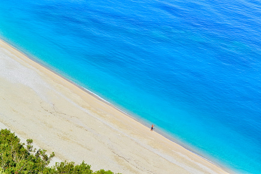 Aerial View of Turquoise Beach with Lone Walker