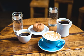 Coffee, Latte, and Donut on Rustic Wooden Table