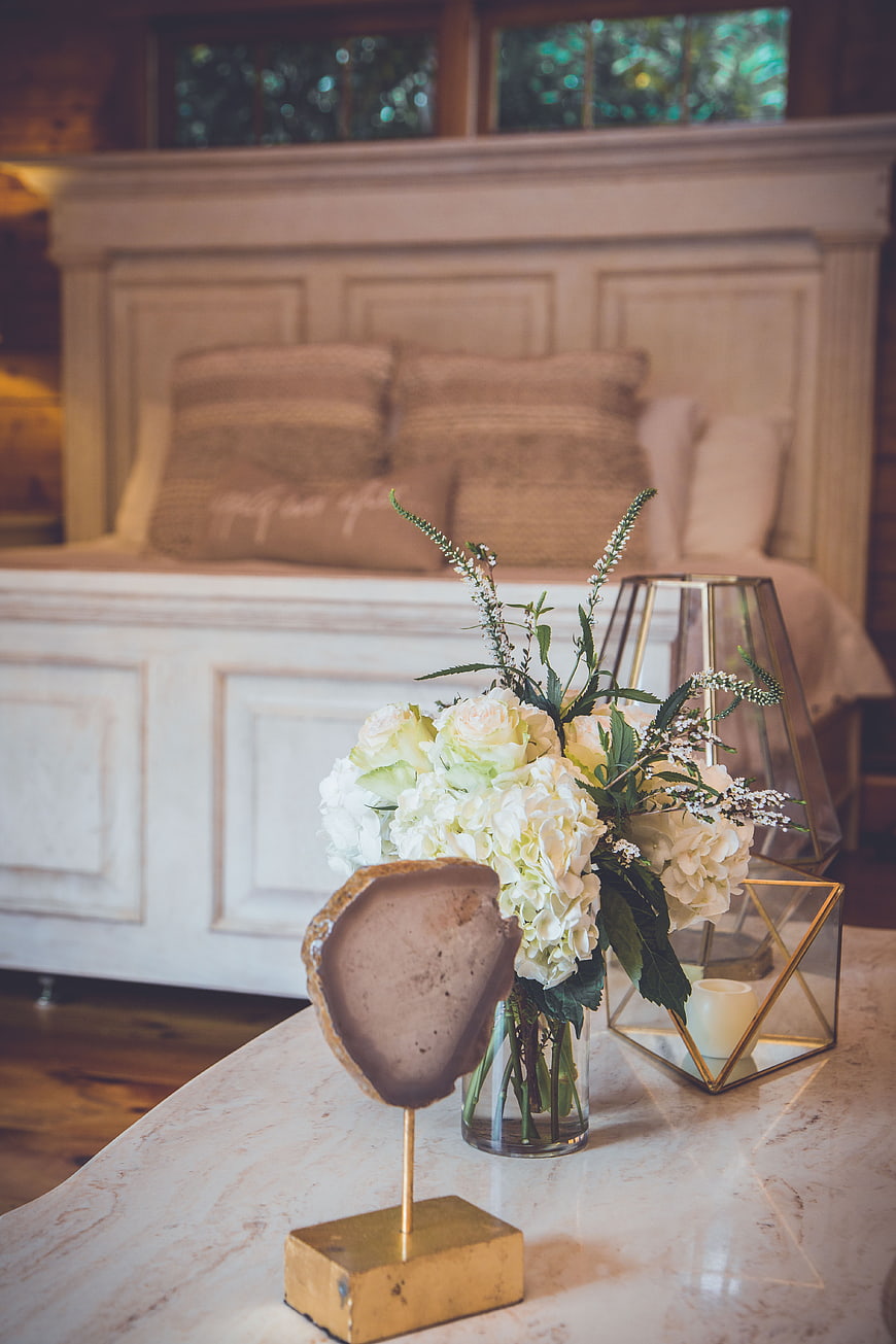 Elegant Bedroom Interior with Floral Arrangement and Decor