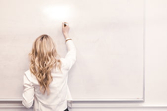 Woman Writing on Whiteboard with Copyspace