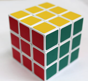 Close-up of a colorful Rubik's cube puzzle on a white background
