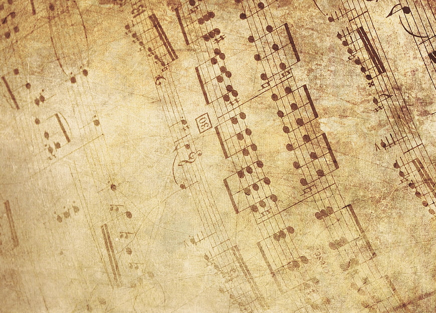 Vintage sheet music background with musical notes and staves