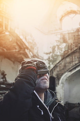 Man with Vintage Camera in Sunlit Ruins