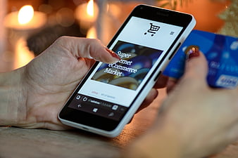 Woman shopping online with smartphone and credit card