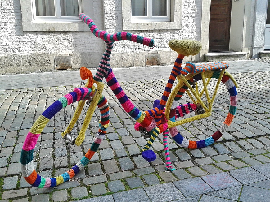 Colorful Knitted Bicycle on Cobblestone Street