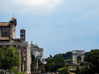 Roman Forum ruins and Arch of Titus in Rome, Italy