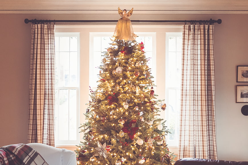 Decorated Christmas Tree in Cozy Living Room with Plaid Curtains