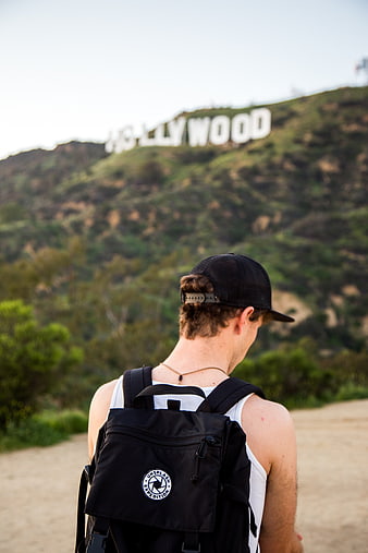Man with Backpack Looking at Hollywood Sign