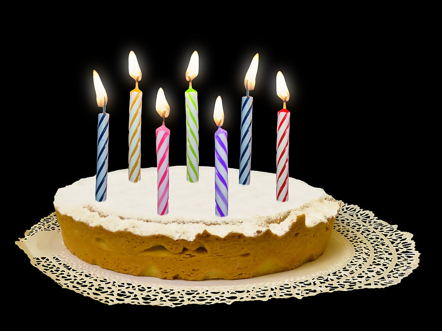 Birthday Cake With Lit Candles On Black Background