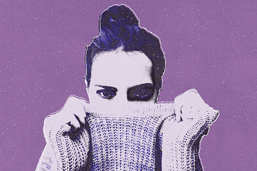Stylized woman with purple background holding sweater over face