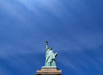 Statue of Liberty against a deep blue sky