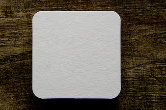 Blank White Coaster on Dark Wood Background