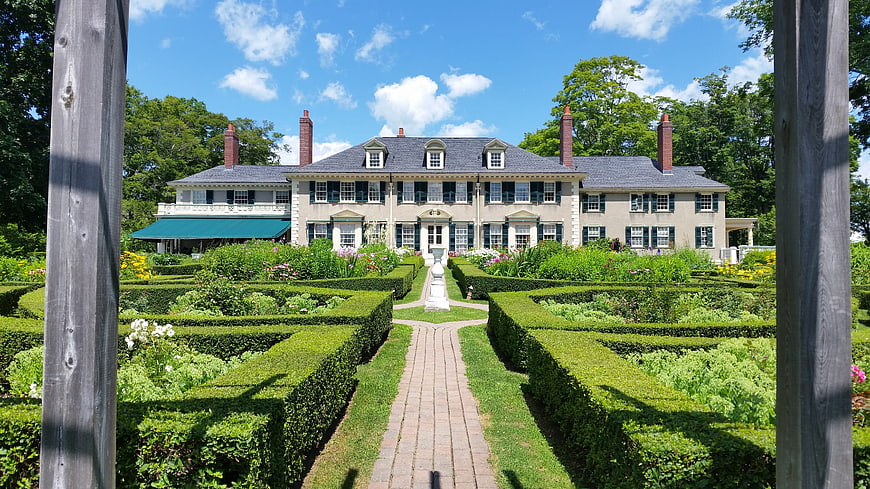 Historic Colonial Mansion With Formal Garden And Brick Pathway