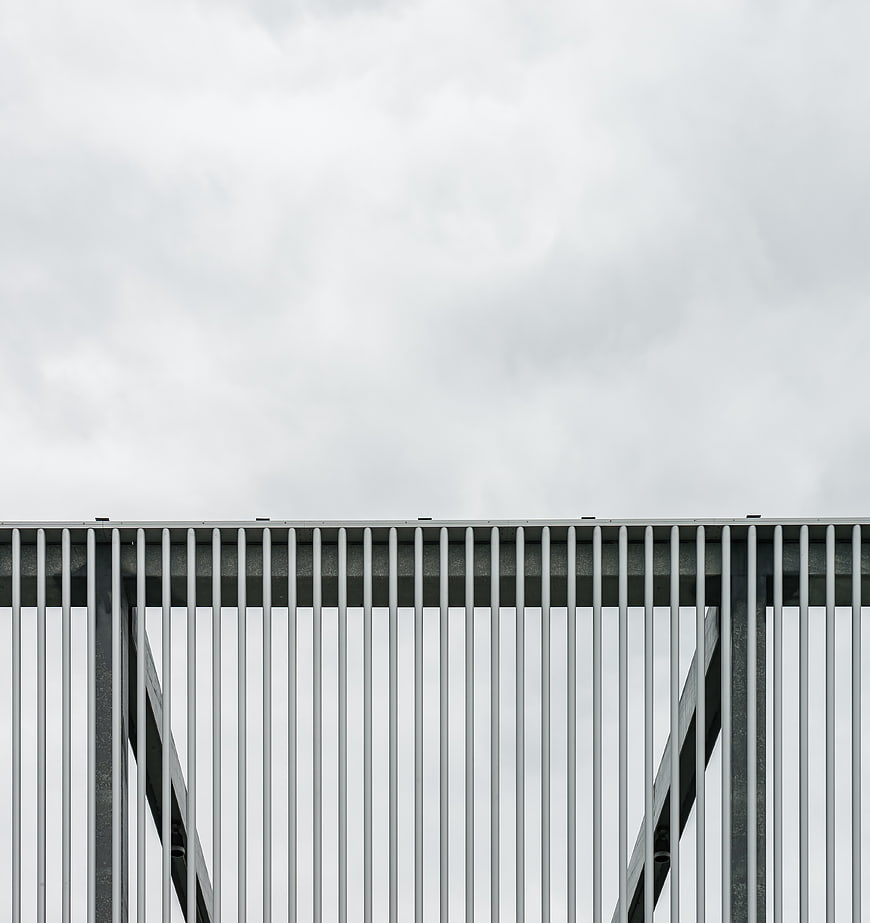 Minimalist Metal Fence Against Overcast Sky