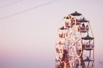 Blurred Ferris Wheel Lights at Dusk