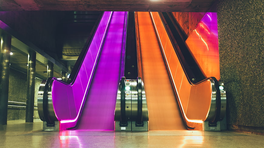 Colorful Neon Escalators in Underground Metro Station