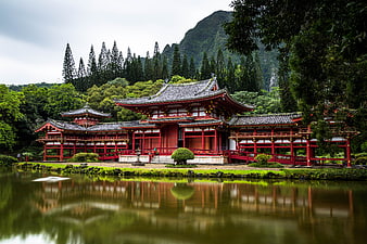 Traditional Japanese Temple by Lake with Mountain Reflection